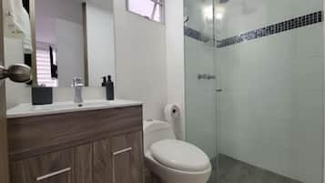 Shower, hair dryer, towels, soap