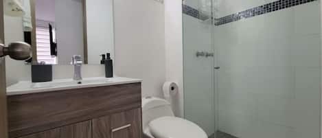 Shower, hair dryer, towels, soap