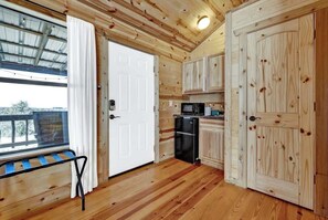 Fridge, microwave, coffee/tea maker, cookware/dishes/utensils