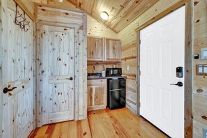 Fridge, microwave, coffee/tea maker, cookware/dishes/utensils