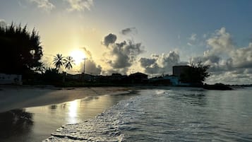 On the beach, sun-loungers, beach towels