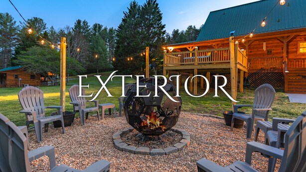 A rustic outdoor seating area with Adirondack chairs, a fire pit, and string lights. - *Timber & Tin* Family Retreat~Creek~Arcade~Hot Tub (Suches)