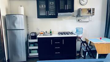 Fridge, microwave, stovetop, coffee/tea maker