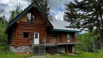 Surrounded by lush greenery, this cabin offers a tranquil retreat.