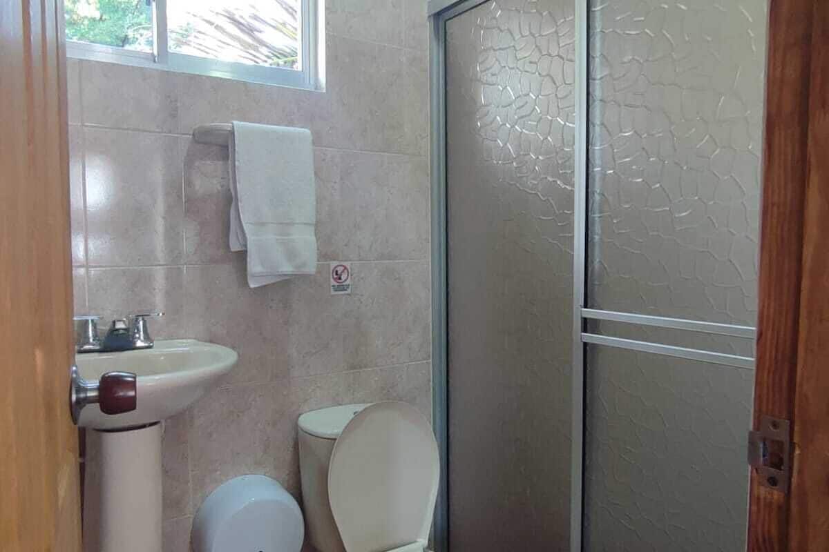 deluxe double room, 1 double bed | bathroom | shower, rainfall showerhead, towels, soap