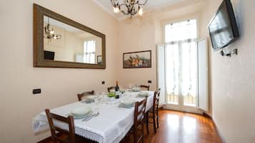 Family Apartment | Living area | 26-inch flat-screen TV with digital channels, TV