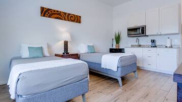 1 bedroom, desk, iron/ironing board, travel crib