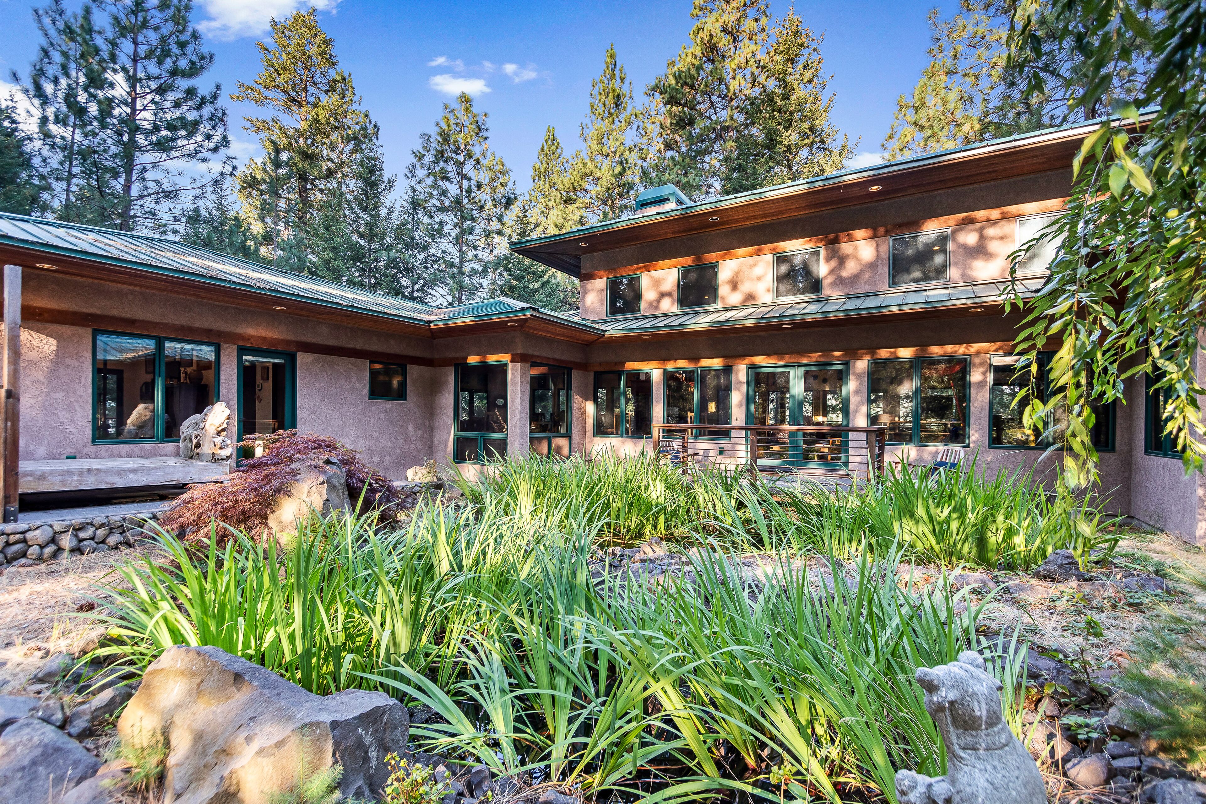 Rustic contemporary in a private forest setting overlooking Lake Coeur d’Alene