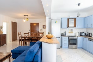 Enjoy cooking in the well-equipped kitchen with oven, microwave, and dishwasher.