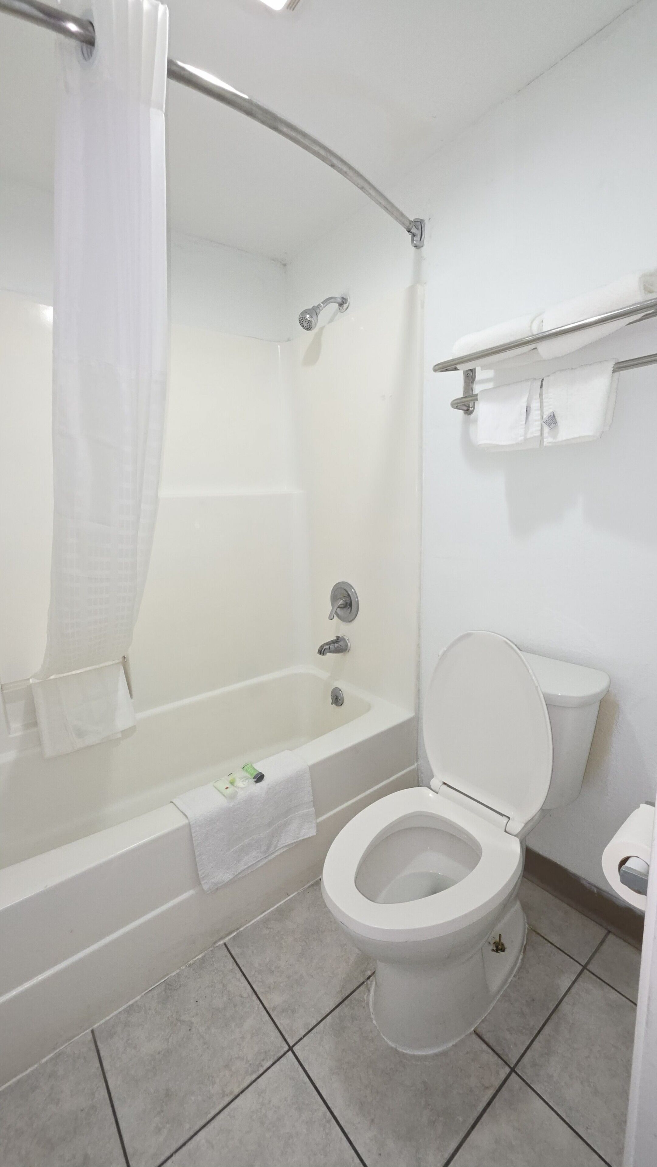 Shower, rainfall showerhead, hair dryer, towels