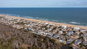 A coastal residential area with houses, a beach, and a clear view of the ocean. - Sandbridge Beach Bay Getaway  (Virginia Beach)