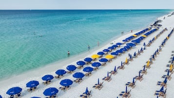 On the beach, sun-loungers