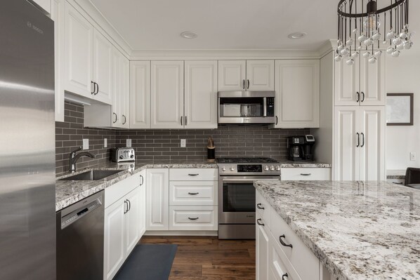Condo, 4 Bedrooms | Private kitchen | Fridge, coffee/tea maker, toaster