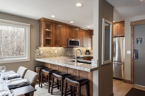 Enjoy meals at the breakfast bar or dining table for four.