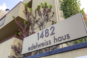 Welcome to Edelweiss Haus, a charming building with a balcony.
