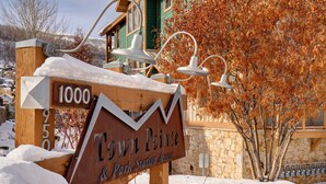 A wooden sign with 'Town Pointe' and 'Park Station Access' indicating a location. - Town Pointe C101 3 Bedroom Condo by RedAwning (Park City)