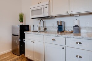 Fridge, microwave, coffee/tea maker, toaster