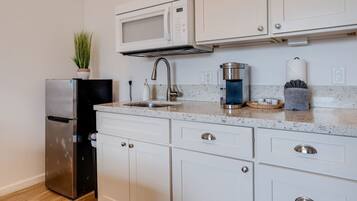Fridge, microwave, coffee/tea maker, toaster