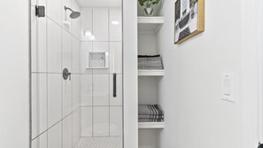 Shower, hair dryer, towels, soap