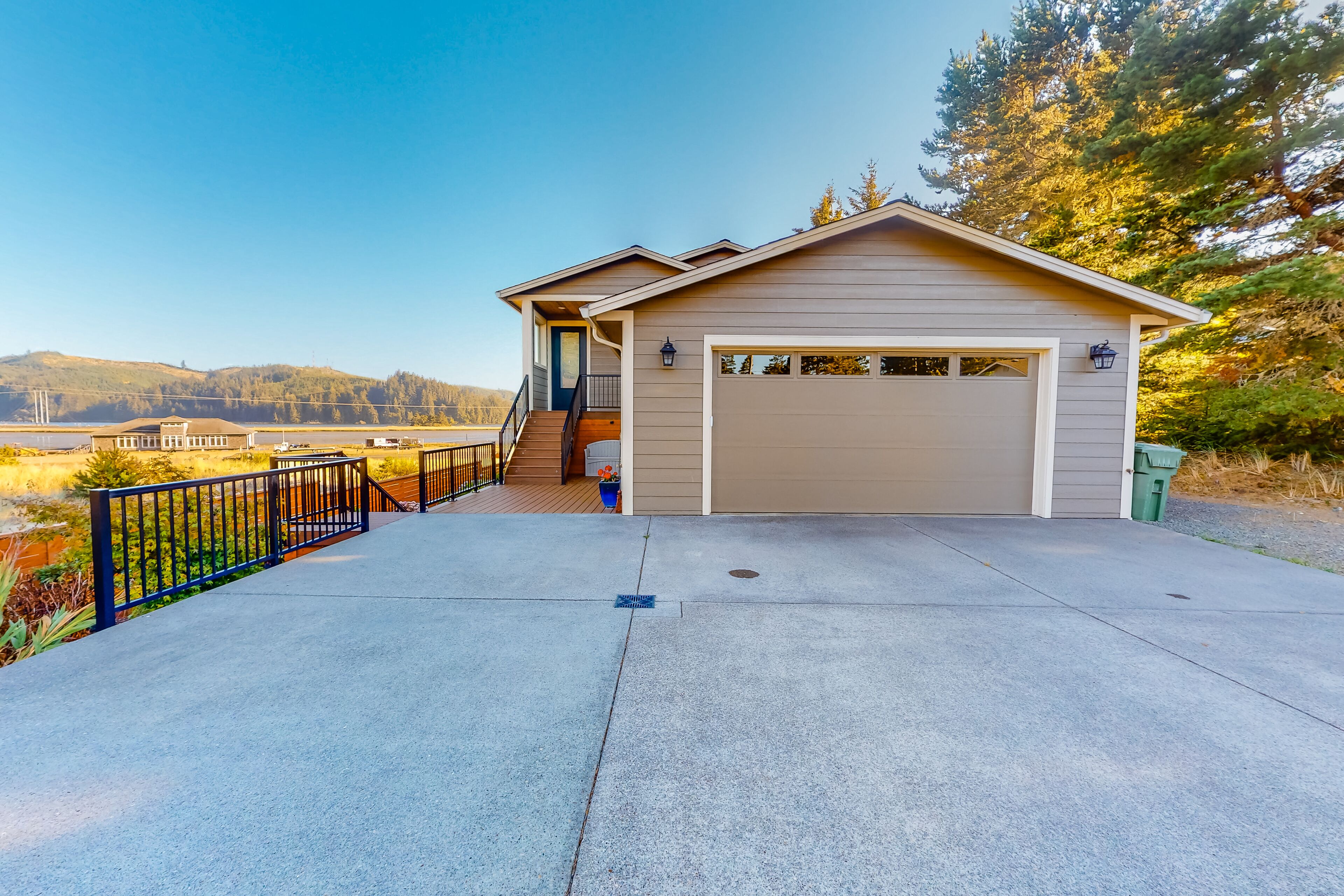 Newly built home with gorgeous water view, spacious deck, 2 kitchens & firepit