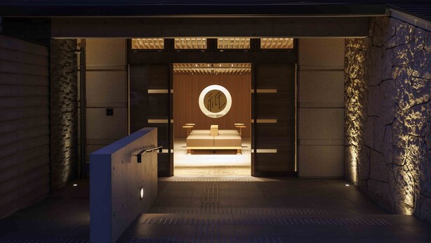 Een moderne hotelentree met een minimalistisch ontwerp, met een centraal gelegen bedgedeelte en een ronde lamp erboven.
