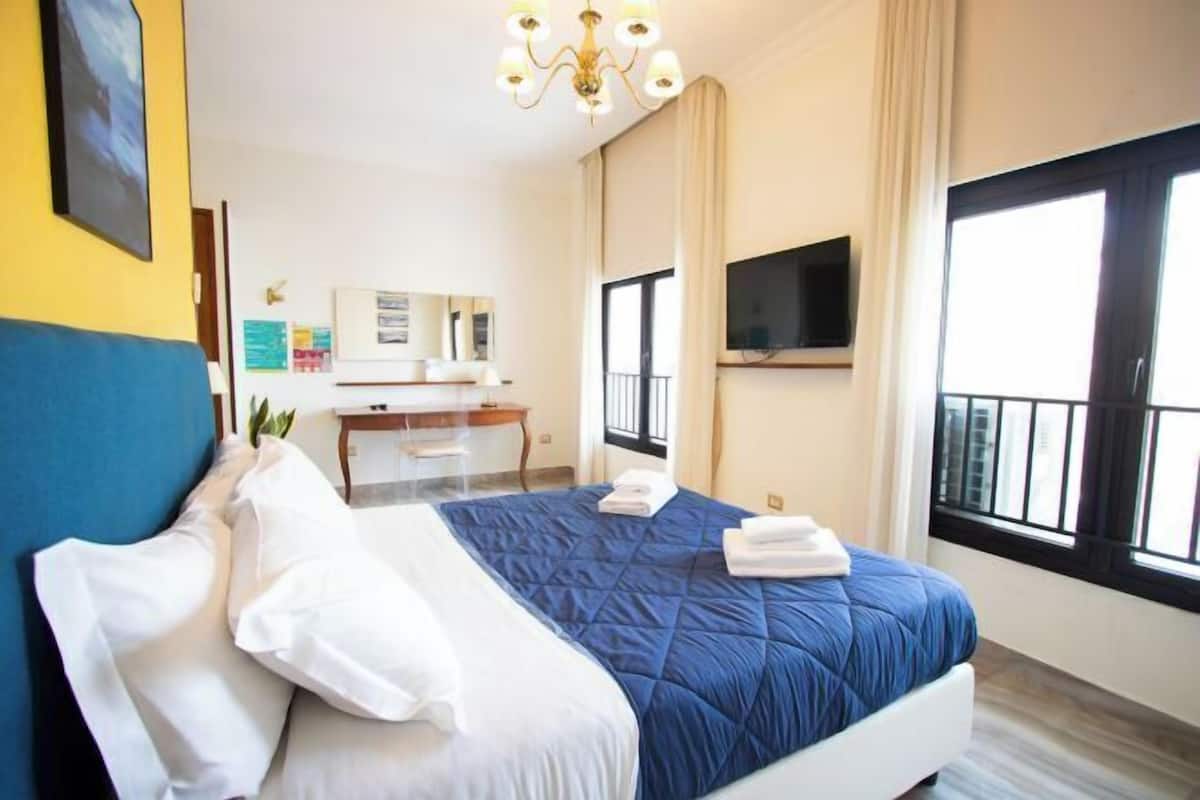 Desk, laptop workspace, free WiFi, bed sheets