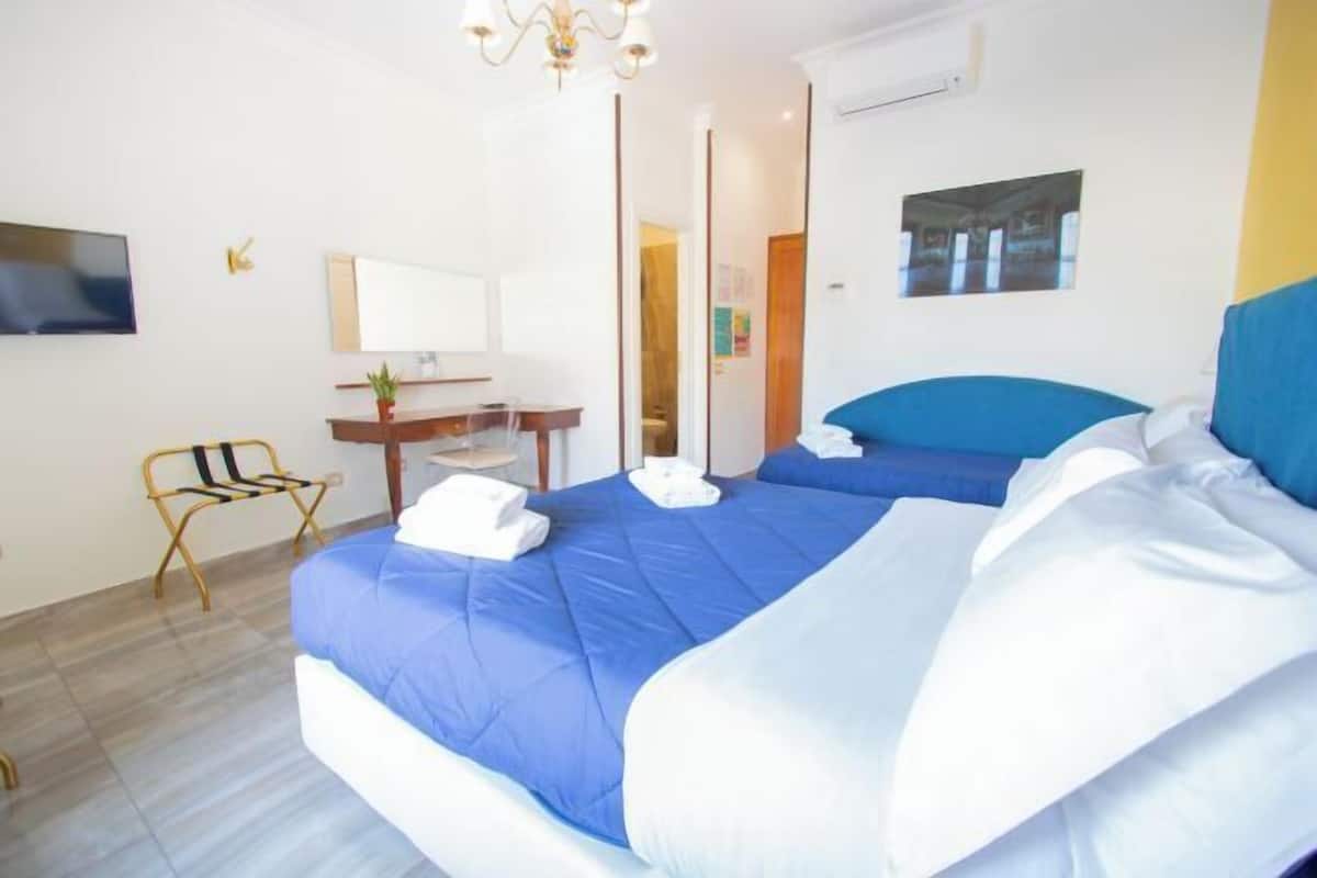 Desk, laptop workspace, free WiFi, bed sheets