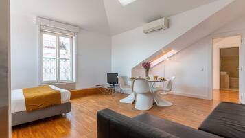 City Apartment | Living area | 32-inch flat-screen TV with cable channels, TV