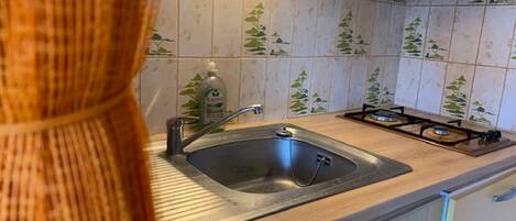 Fridge, microwave, stovetop, coffee/tea maker