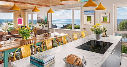 Sunset Beach House, Porthleven, with panoramic sea views. Comfortably sleeps 10