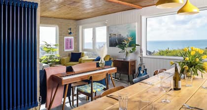 Sunset Beach House, Porthleven, with panoramic sea views. Comfortably sleeps 10