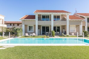 An infinity pool, pool loungers