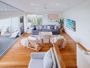 Smart TV - Sand may brush off your feet but memories at The Coast House last forever. (Black Head)