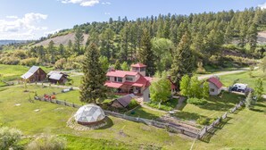 A rural property with a large house, barns, and a geodesic dome structure. - Rancho Sendero Correo -Historic Home on 300 Acres- Hot Tub/Pool Table/Trails (Hesperus)