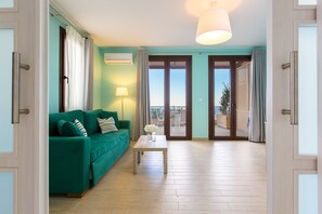 Suite, 1 Bedroom, Sea View | Living area | 32-inch flat-screen TV with satellite channels, TV - Stella in the Village Suites (Agios Vasileios)