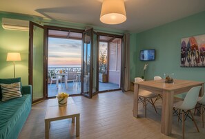 Suite, 1 Bedroom, Sea View | Living area | 32-inch flat-screen TV with satellite channels, TV - Stella in the Village Suites (Agios Vasileios)