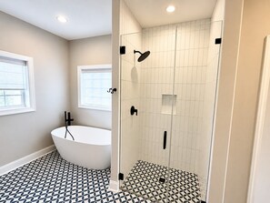 Shower, hair dryer, towels, toilet paper