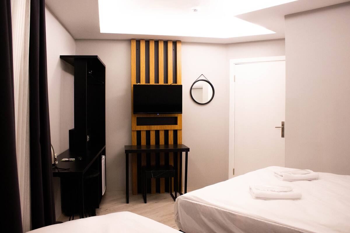 Triple Room | Frette Italian sheets, premium bedding, Select Comfort beds