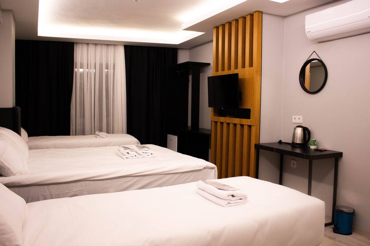 Family Quadruple Room | Frette Italian sheets, premium bedding, Select Comfort beds