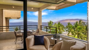 A balcony with a view of the ocean and palm trees. - Polo Beach Club Two Bedrooms - Ground Floor by Coldwell Banker Island Vacations (Kihei)