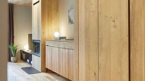 A modern kitchen with wooden cabinetry and a built-in stove.