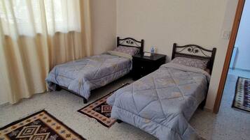 Departamento familiar | Baño | Tina con regadera, regadera tipo lluvia, amenidades de baño gratuitas