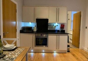 Fridge, microwave, oven, stovetop - Apartment 2, 11 The Beach - Beachfront Apartment (Filey)