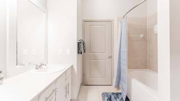 Shower, hair dryer, towels, shampoo