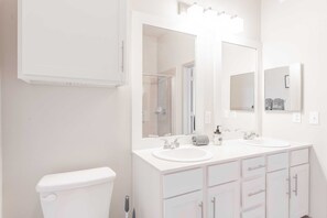 Shower, hair dryer, towels, shampoo
