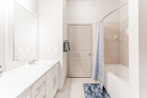 Shower, hair dryer, towels, toilet paper