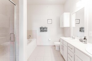 Shower, hair dryer, towels, shampoo