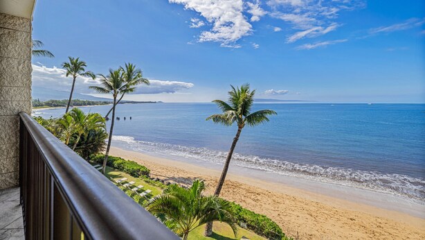 A beach view with palm trees and a clear sky. - Kihei Beach, #406^ 1 Bedroom Condo by RedAwning (Kihei)