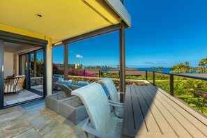 A balcony with outdoor seating, a view of the ocean, and a clear sky. - Wailea Elua, #0305 2 Bedroom Condo by RedAwning (Kihei)