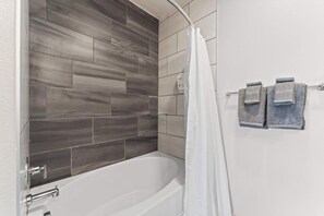 Shower, hair dryer, towels, shampoo